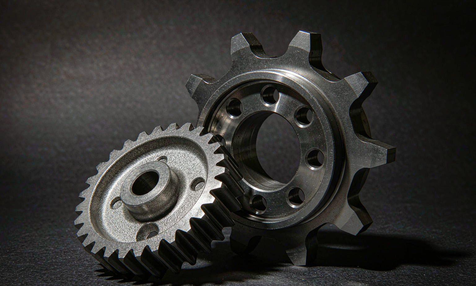 Heat-treated powder metal transmission gear replacing a machined steel gear