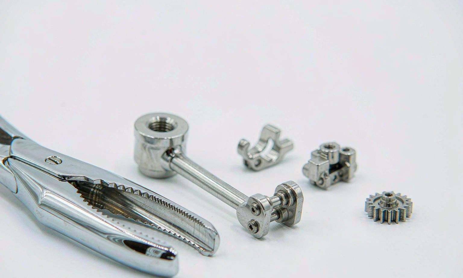 Precision sintered and MIM components for medical and surgical devices